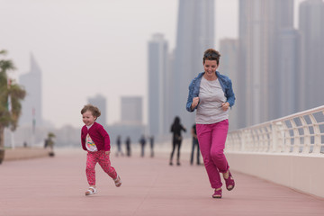 mother and cute little girl on the promenade