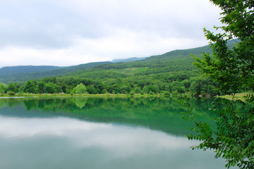 Fototapeta na wymiar Mirror lake, high in the mountains, Crimea