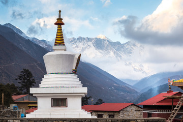 Buddhist stupa of Tengboche Monastery and the top of Everest in the background, Tengboche Monastery, Everest Base Camp Trek, Sagarmatha National Park, Nepal.  - obrazy, fototapety, plakaty