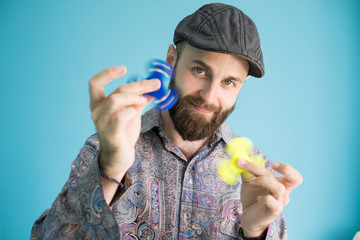 Cheerful man with hand spinner