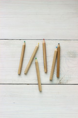 Close up color pencils on wooden table, concept of art and education