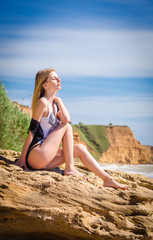 Fototapeta na wymiar Hot blonde on a beach