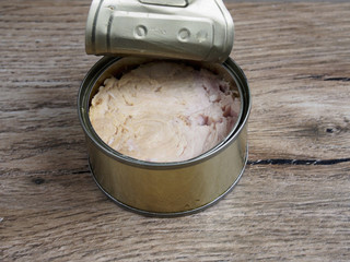 Tuna canned on wood background