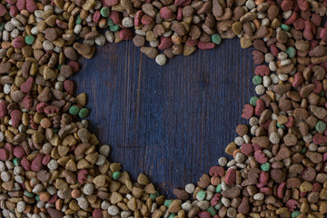 Shape of a heart on dry pet food. For text.