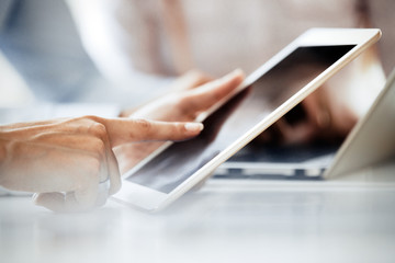 Close up picture of businessman using tablet