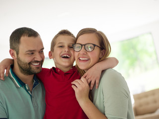 Fototapeta premium family with little boy enjoys in the modern living room