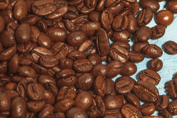 Dark many roasted coffee beans texture background