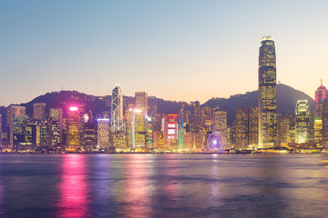 Cityscape and skyline at Victoria Harbour in Hong Kong city at twilight time.