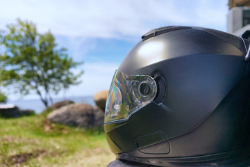 Helm of a motorcyclist on the beach