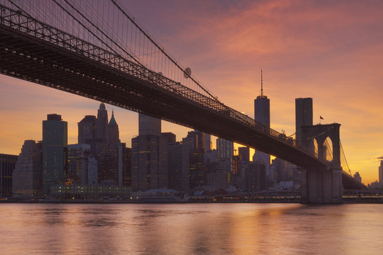 Brooklyn Bridge and New York City skyline at sunset