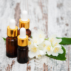 Fototapeta na wymiar Massage oils and jasmine flowers