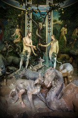 Sacro Monte di Varallo, Piedmont, Italy, June 02 2017 - biblical characters scene representation of Adam and Eve in the Eden - obrazy, fototapety, plakaty