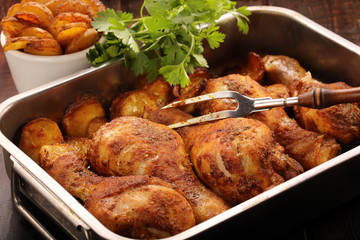 Roasted chicken legs with potato chips