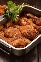 Roasted chicken legs with potato chips