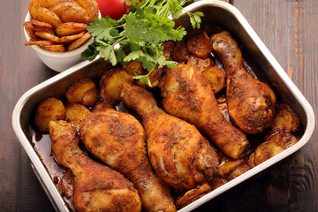 Roasted chicken legs with potato chips