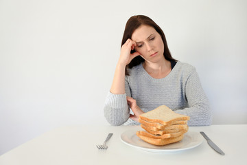 Young woman suffers from a gluten