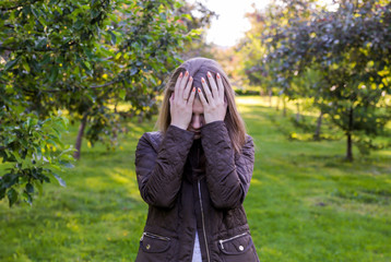 Young lonely girl in the park