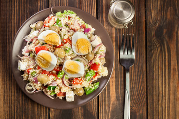Fresh salad with couscous and eggs