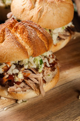 Homemade pulled pork burger with coleslaw salad