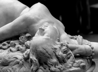 White marble head of young woman.
