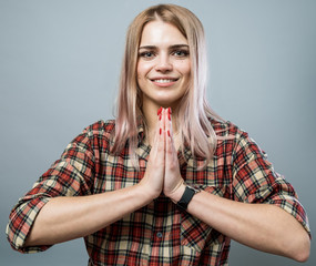 Cute girl with palms together