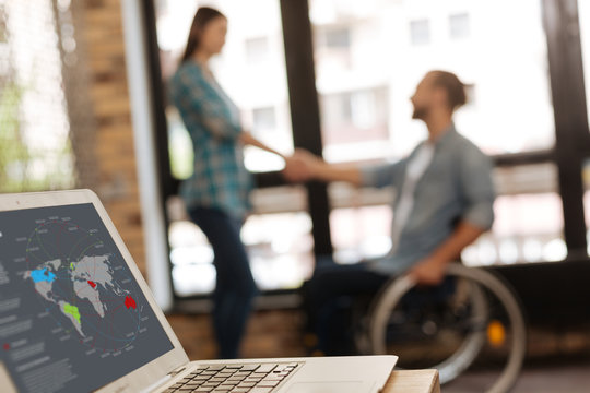 Motivated young entrepreneurs collaborating for their new project - Powered by Adobe