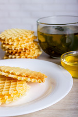 waffles with honey and cup of tea