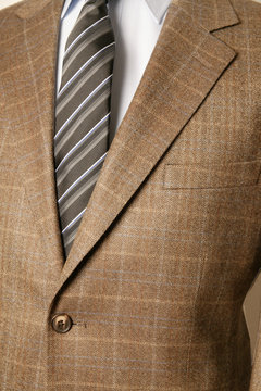 close up of man in a suit with tie and handkerchief