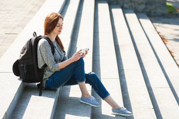 Obraz na płótnie Canvas girl sitting on stone steps 04