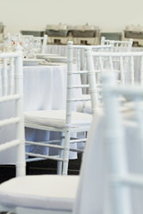 detail of white chairs, fancy wedding decoration
