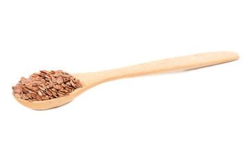 Flax seeds in wooden spoon isolated on white background