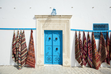 blue arab door in Tunisia with carpets
