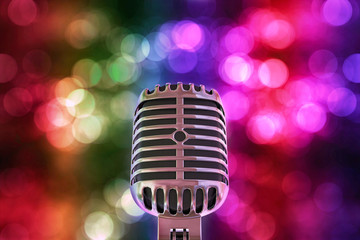Fototapeta na wymiar 3d illustration of vintage retro microphone with colorful bokeh as background