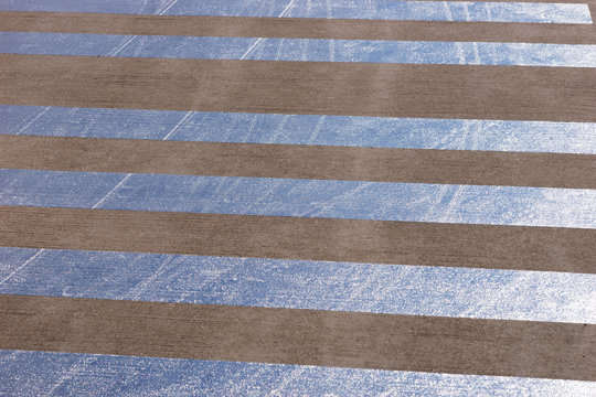 Reflective stripes on the asphalt of the airport landing stage