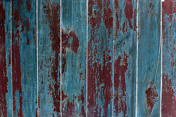 Dark grunge wood background texture with knots and nail holes