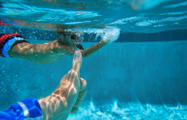 love sport - thumb up and little boy swim underwater