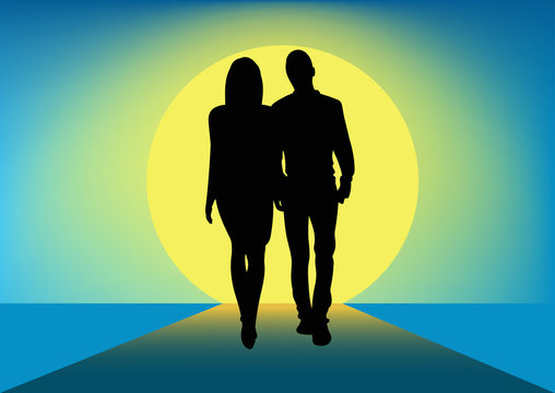 Silhouette of a couple walking next to each other towards the sun