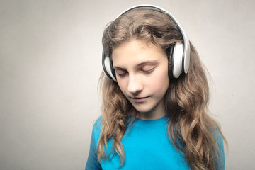 Sweet girl listening music with headphones