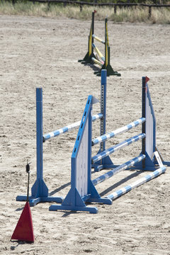 vertical shot of wooden sport barriers for show jumpers