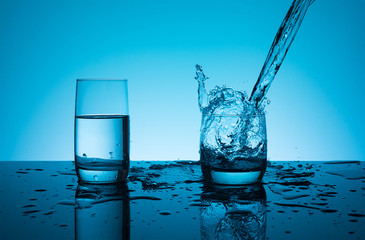 Creative splashing water in the glass