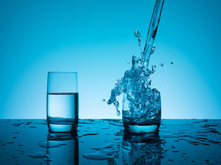 Creative splashing water in the glass