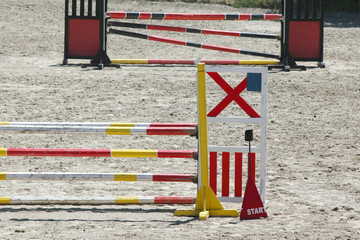 Colorful wooden barriers on the ground for jumping horses and riders