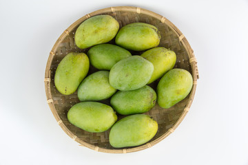 Mango in bamboo basket isolated on white background