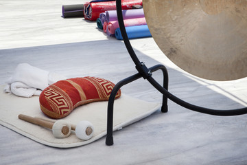 Close up of bronze gong in metallic frame