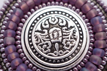 Seed bead embroidered lilac mandala with metal button. Hand made art object