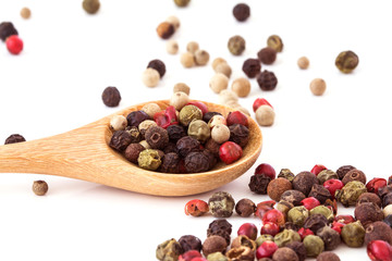 Close up mixed type of the peppercorns in wooden spoon