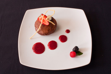 brownie dessert with red fruits sauce