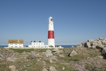 Fototapeta na wymiar Lighthouse of the isle of portland on a sunny day on a blue sky