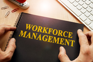 Book with name workforce management in an office.
