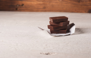 Chocolate on rustic wood,